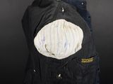 an image of a man ' s jacket with a hat on it