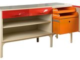 an orange and white cabinet with drawers and a drawer