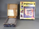 an open box with an electronic organiser inside of it