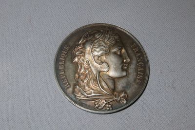 a coin with a woman ' s head on it