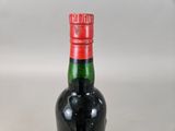 a bottle of wine that is sitting on a table