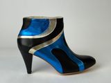 black and blue high heeled ankle boots with metallic accents