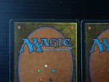 two decks of magic the gathering are shown on a table