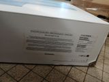 a white box that is sitting on a tiled floor