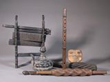 a wooden chair, a chair, a flute, a mask, and a cane
