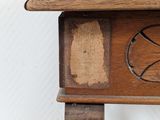 a small wooden table with a basketball design on it
