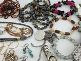 many different types of jewelry on the table