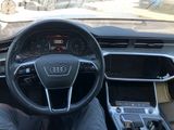 dashboard view of a car with a steering wheel and dashboard controls
