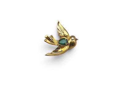 an image of a gold bird with a green stone in its beak