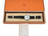 an image of a watch in a box on a white background