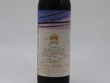 a bottle of wine that is sitting on a table