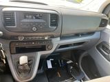 a dashboard of a car with a radio and other electronics