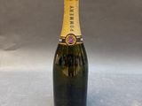 a bottle of champagne sitting on top of a table