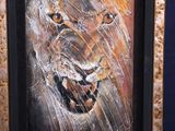 a picture of a painting of a lion in a picture frame