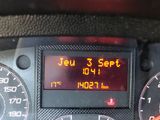 a digital clock on the dashboard of a car