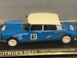 a blue car with a white roof in a clear case