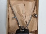 a small metal object in a box on the wall