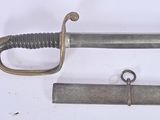 two swords that are laying next to each other on a table