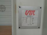 a picture of a white refrigerator with a red and white sign