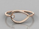 a close up of a rose gold ring with a diamond in the center