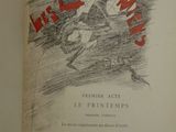 an old book with a drawing of a man riding a motorcycle
