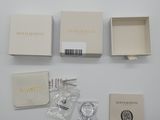the contents of a watch are laid out on a white surface