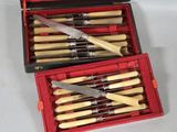 a red box with knives and a pair of knives in it
