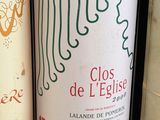 several bottles of wine are lined up on a shelf