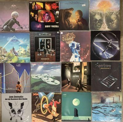 many different album covers on the wall of this room