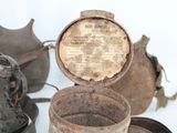three old tins that are sitting on a table