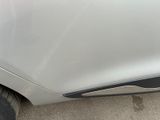 a close up of a car ' s front bumper and fender