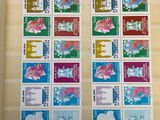 a close up of a picture of stamps on a wall