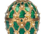 an image of a green and gold faber egg with pearls on it