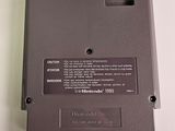 the back of a nintendo game console sitting on top of a white table