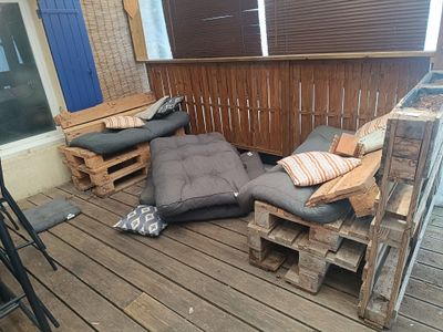several pieces of wood are stacked on top of each other on a deck