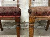 two chairs that are sitting next to each other