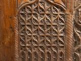 an old wooden chest with carvings on the front and sides