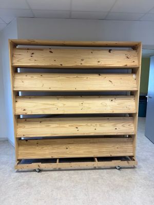 a close up of a wooden shelf in an empty room