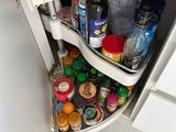 an image of a kitchen cabinet with a pull out shelf