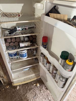 an open refrigerator with a lot of food inside of it