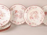 four plates with floral designs are stacked on top of each other