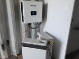an image of a white refrigerator sitting in a room with a wall mounted heater