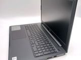 a laptop computer sitting on top of a white table