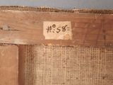 a close up of a piece of wood with a tag on it