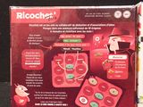 packaging of a red electronic device on a black surface