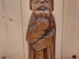 wooden statue of a man with a beard and a beard