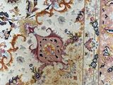 an image of a rug with a floral design on it