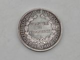 a close up of a coin on a table with a white background