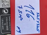 a piece of paper with writing on it next to a book
