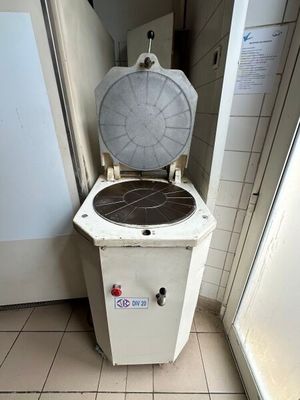 a white toilet sitting in a bathroom next to a door